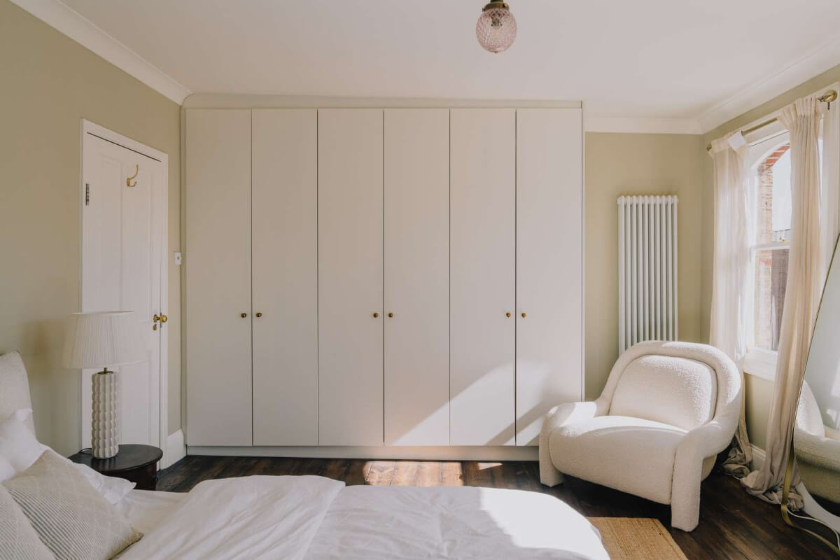 A Serene Color Palette and Built-In Shelves in a London Duplex 18 beige bedroom built-in wardrobes