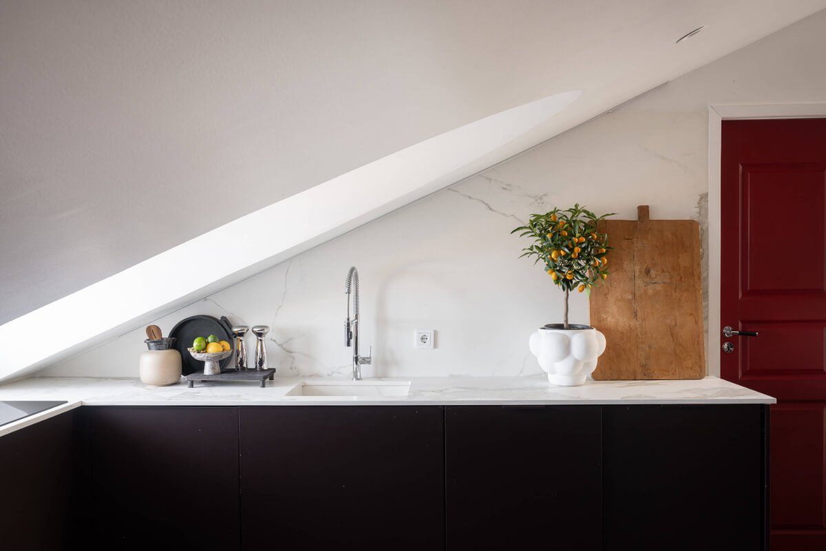 black kitchen marble countertop slanted ceiling