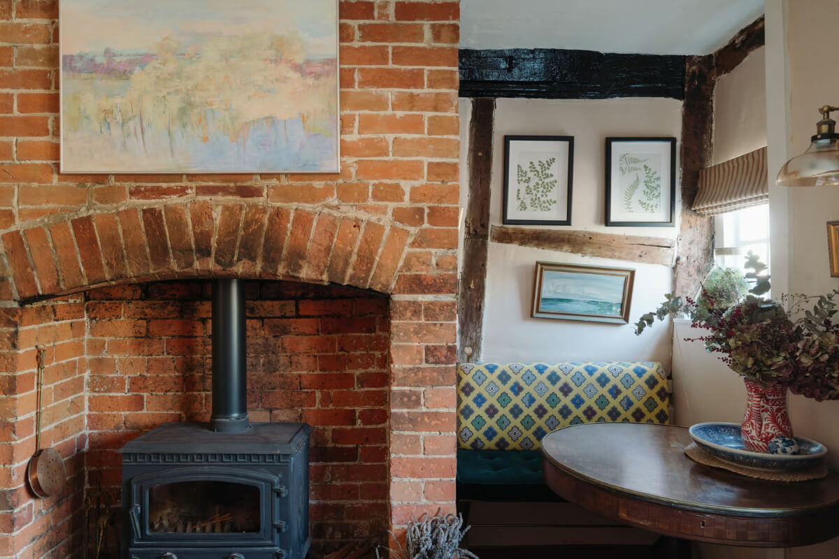 brick fireplace built-in seating niche cottage living room