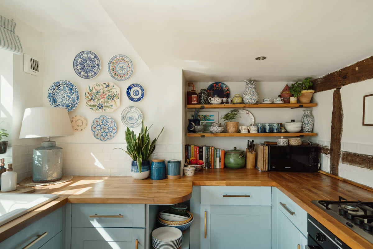 charming blue cottage kitchen wooden shelves plates wall decor