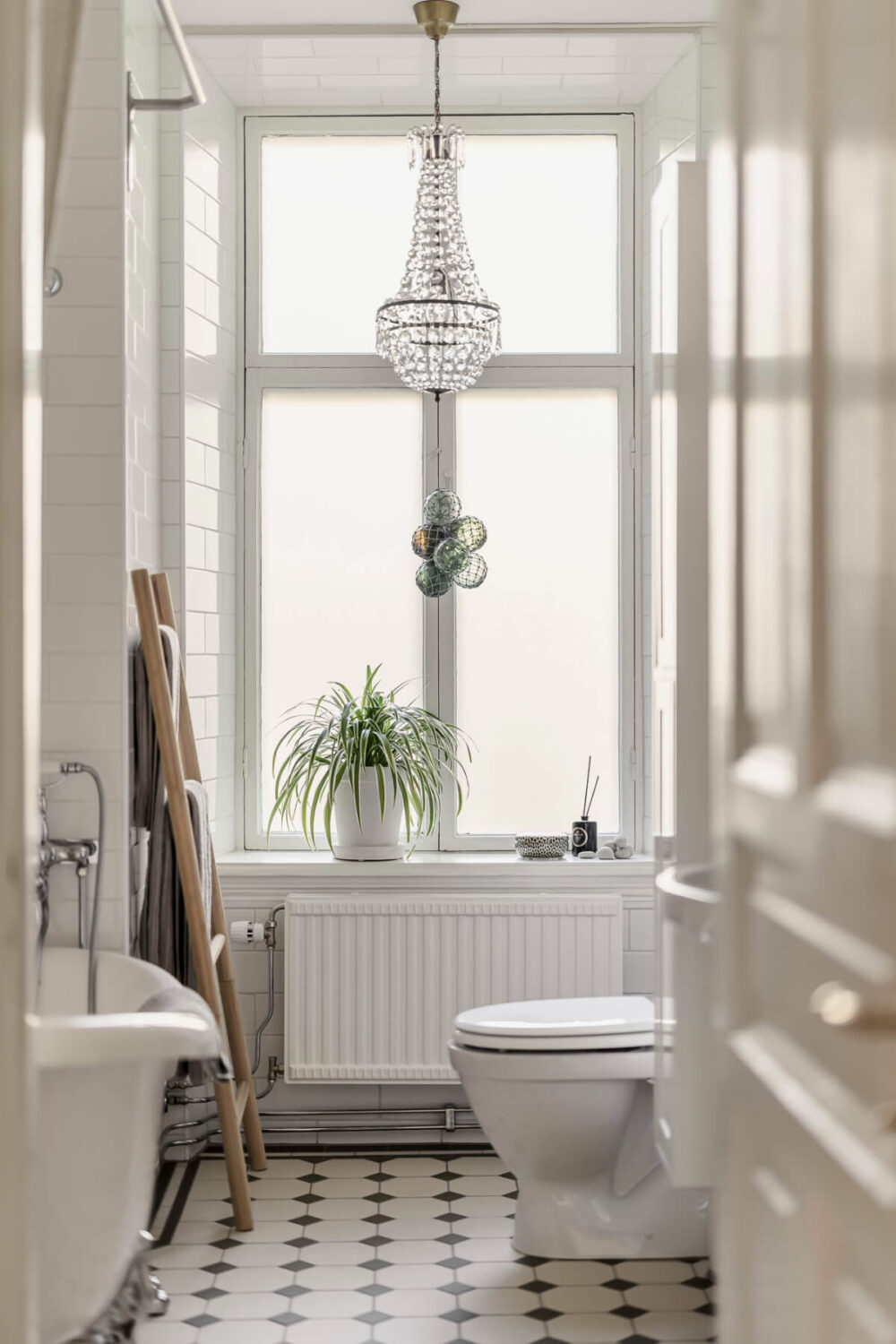 A Bright Swedish Apartment with Period Features and a Green Kitchen 23 classic black and white bathroom large window