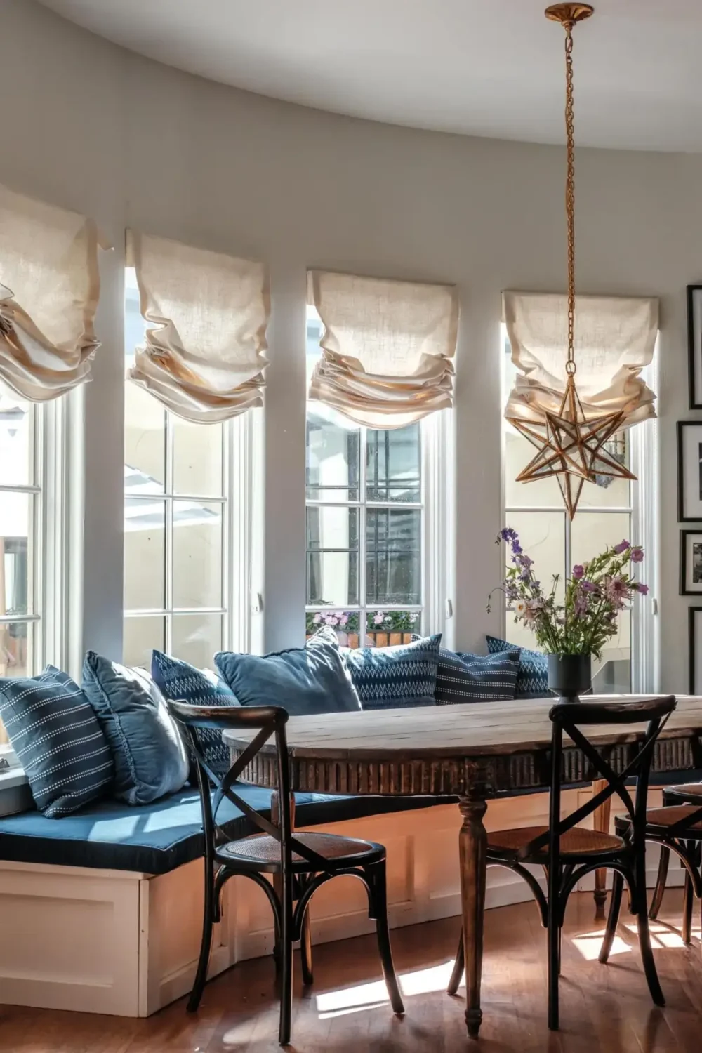 Mediterranean Elegance Meets Modern Living in the Heart of Bonnie Brae 9 curved built-in bench kitchen table