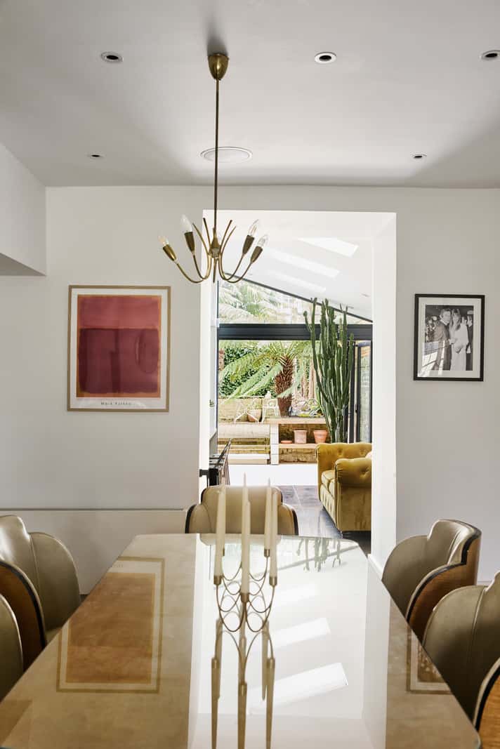 Light and Dark in a Spacious Victorian Townhouse in London 9 dining room open doorway kitchen