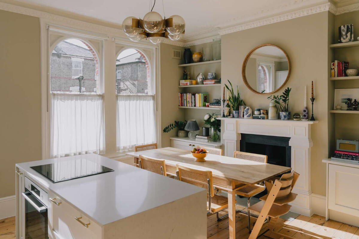 A Serene Color Palette and Built-In Shelves in a London Duplex 6 dining table fireplace built in shelves