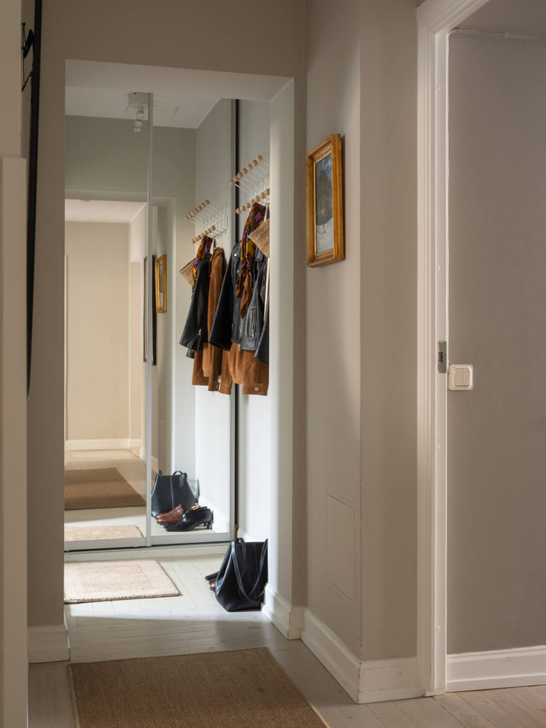 A Muted Palette and a Cozy Kitchen Breakfast Nook in a Swedish Apartment 22 entry hall mirror wardrobe A Muted Palette and a Cozy Kitchen Breakfast Nook in a Swedish Apartment