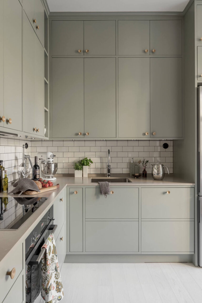 A Bright Swedish Apartment with Period Features and a Green Kitchen ...