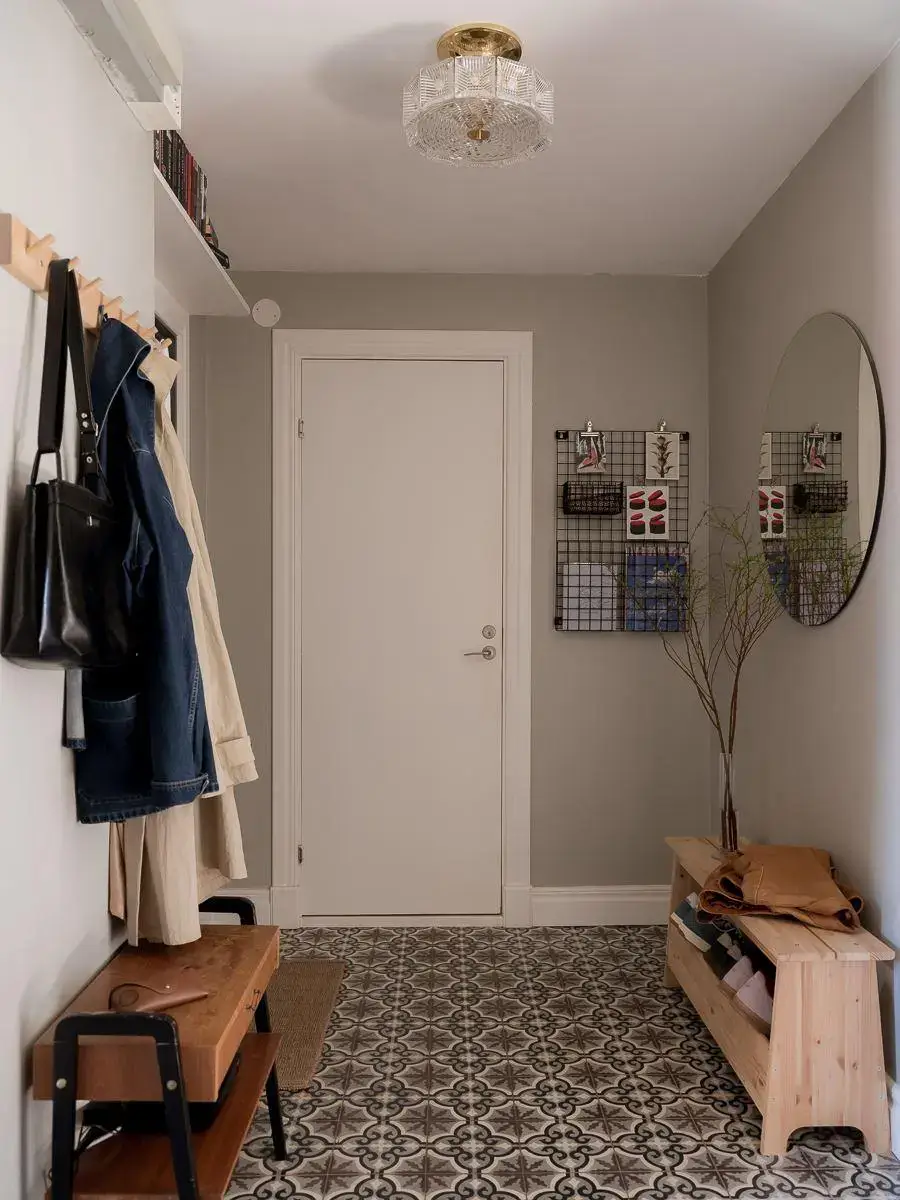 Gray Walls in a Renovated 19th-Century Gothenburg Apartment 22 hall gray walls floor tiles