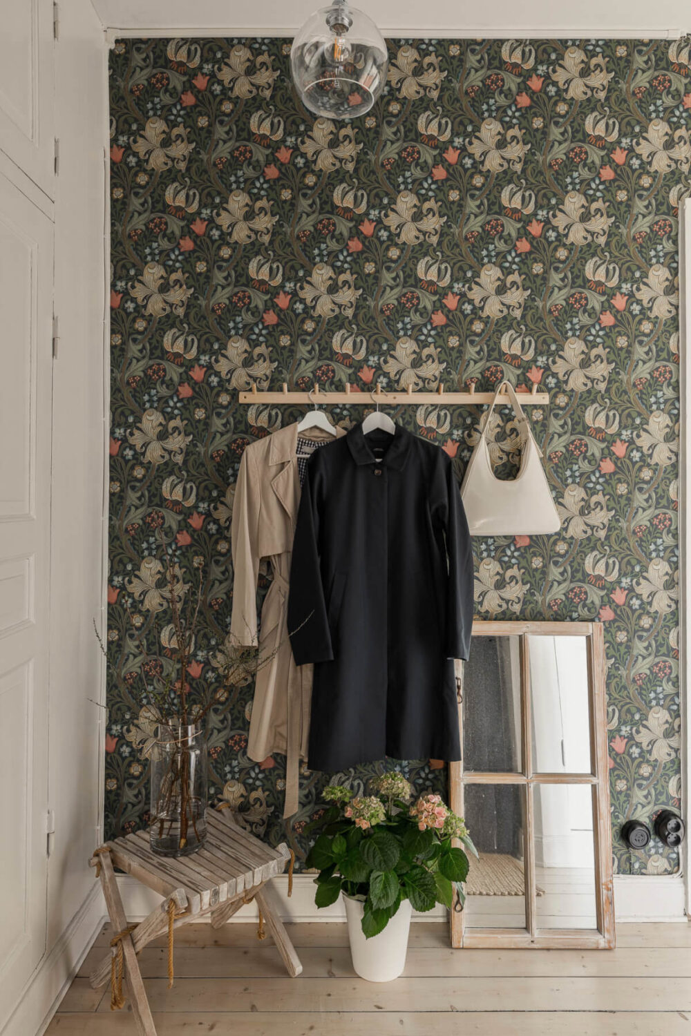 A Bright Swedish Apartment with Period Features and a Green Kitchen 26 hall wallpaper wooden floor