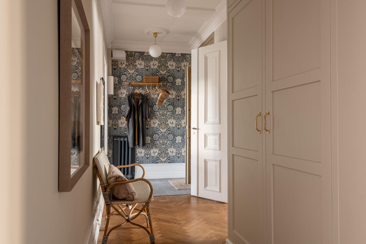 A Stunning Kitchen in a Classic Renovated Turn-of-the-Century Apartment 31 hall with blue wallpaper