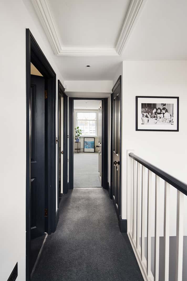 Light and Dark in a Spacious Victorian Townhouse in London 31 hall with carpet