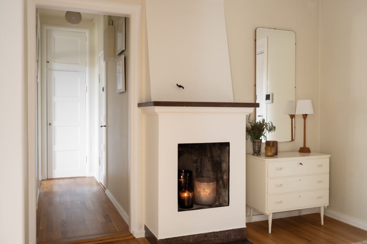 A Beige Color Palette and Built-in Bookshelves in a 1920s Apartment 18 hall with fireplace 1 A Beige Color Palette and Built-in Bookshelves in a 1920s Apartment