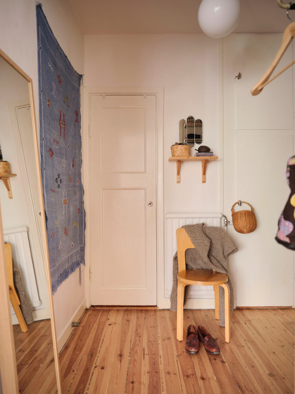 A Light-Filled Functionalist Apartment in Stockholm 19 hall wooden floor A Light-Filled Functionalist Apartment in Stockholm