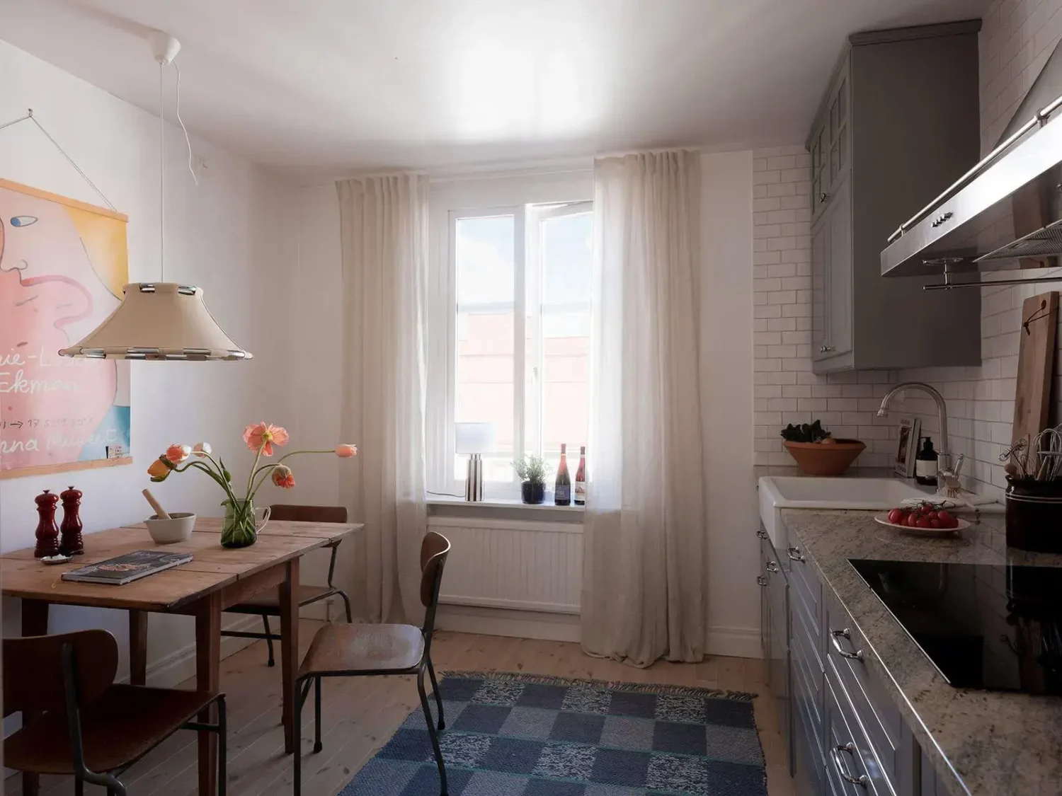 Gray Walls in a Renovated 19th-Century Gothenburg Apartment 14 kitchen blue rug rustic wooden table