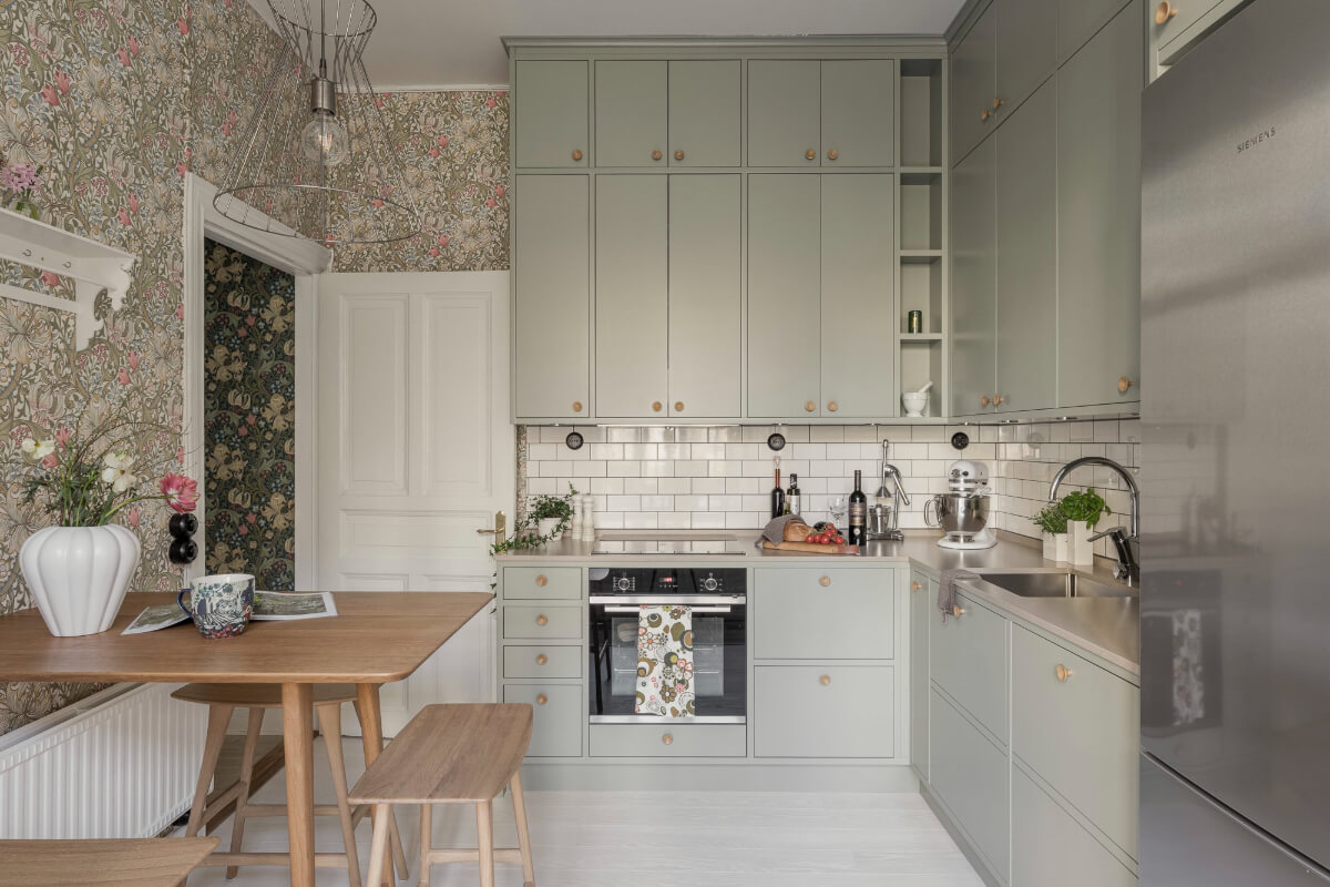 A Bright Swedish Apartment with Period Features and a Green Kitchen 3 kitchen green cabinets wallpaper