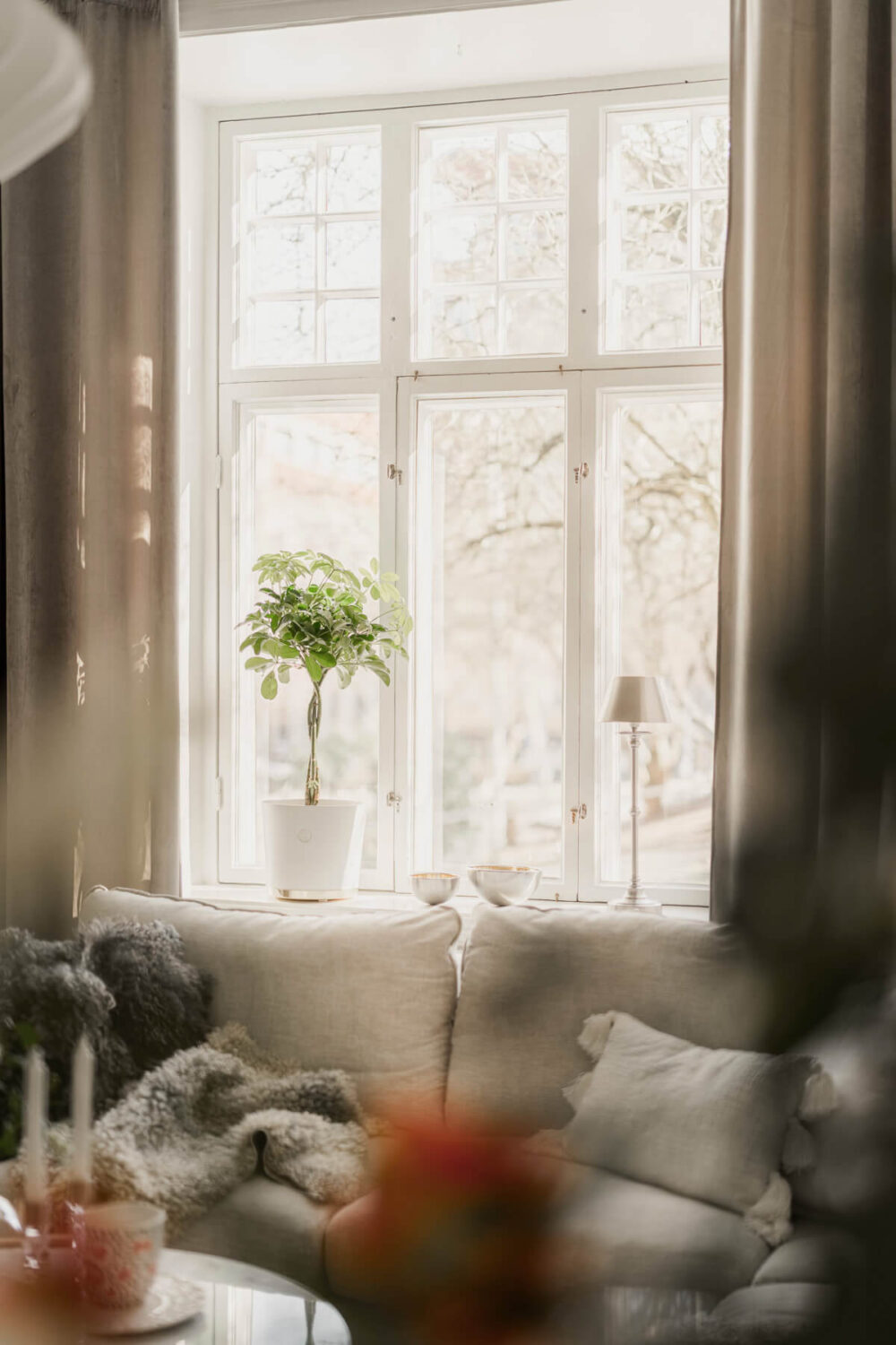A Bright Swedish Apartment with Period Features and a Green Kitchen 12 large living room window