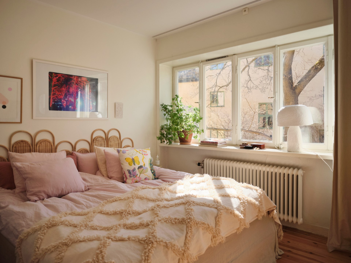 A Light-Filled Functionalist Apartment in Stockholm 13 light bedroom wicker headboard