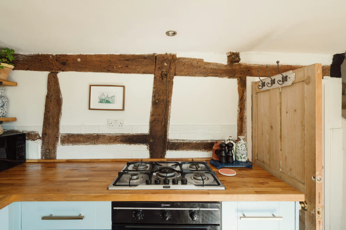 light blue cottage kitchen timber beams