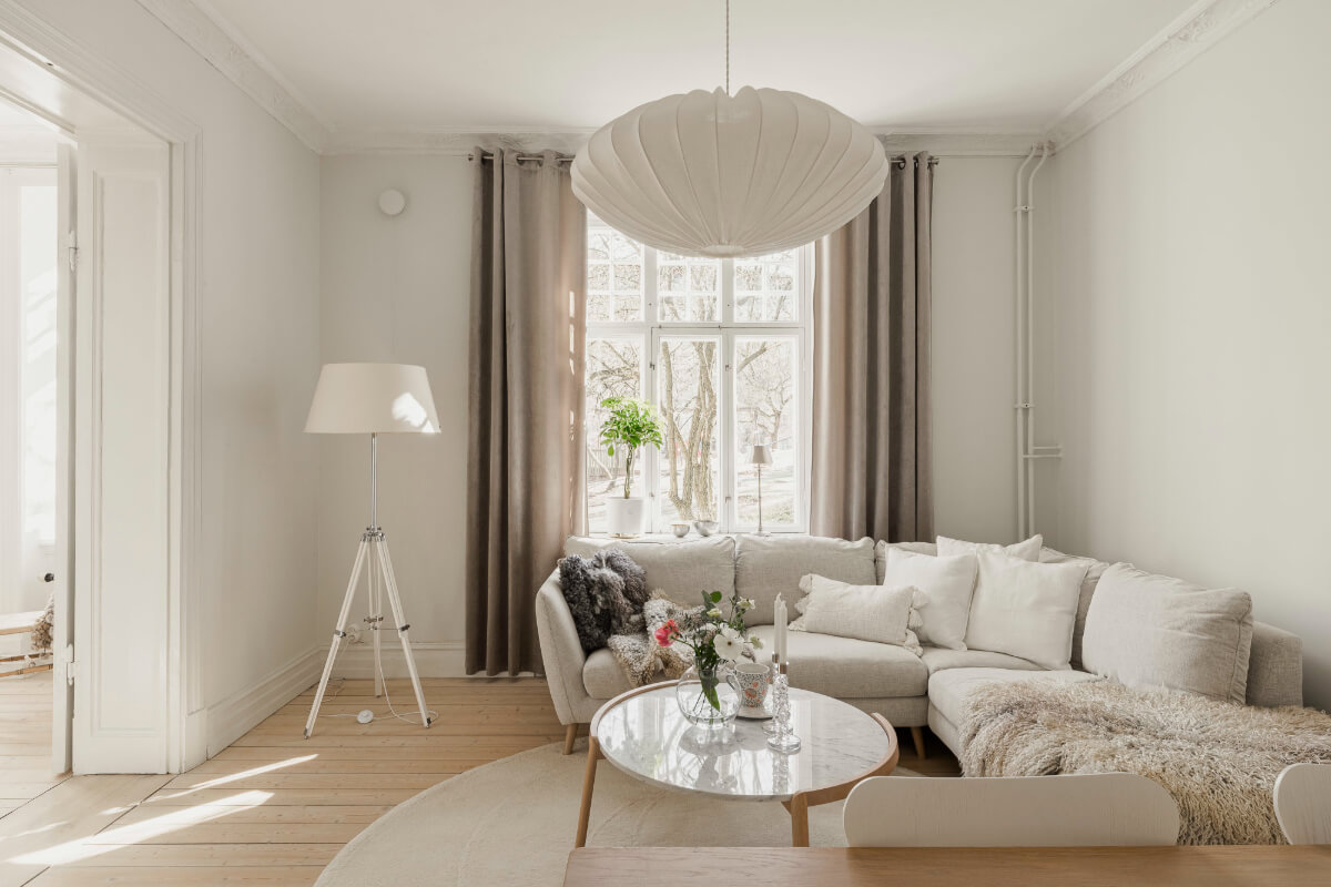 A Bright Swedish Apartment with Period Features and a Green Kitchen 11 light-colored living room wooden floor