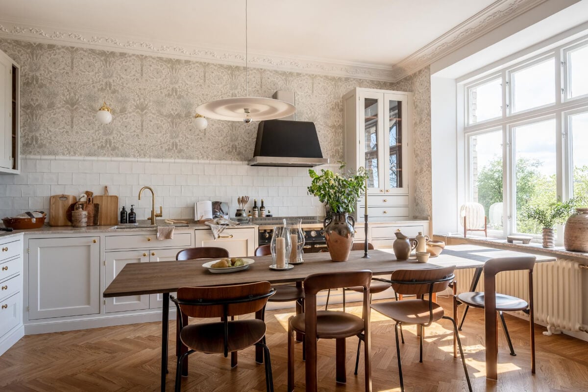 A Stunning Kitchen in a Classic Renovated Turn-of-the-Century Apartment 2 light gray kitchen large dining table wallpaper