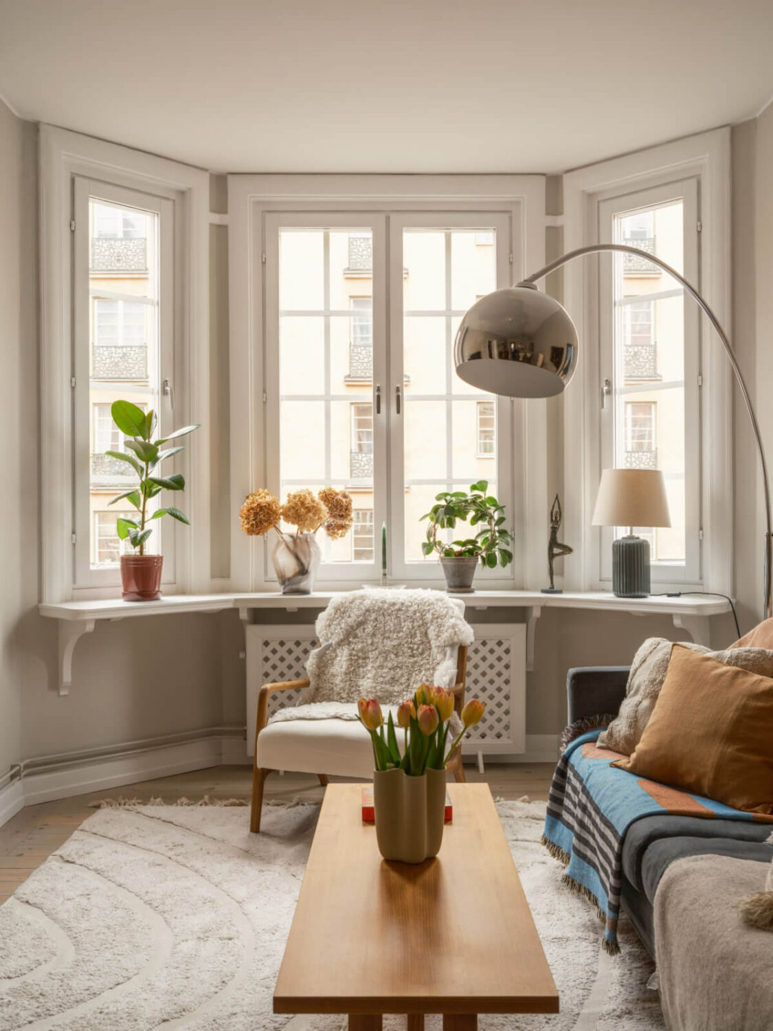 A Muted Palette and a Cozy Kitchen Breakfast Nook in a Swedish Apartment 2 living room bay window