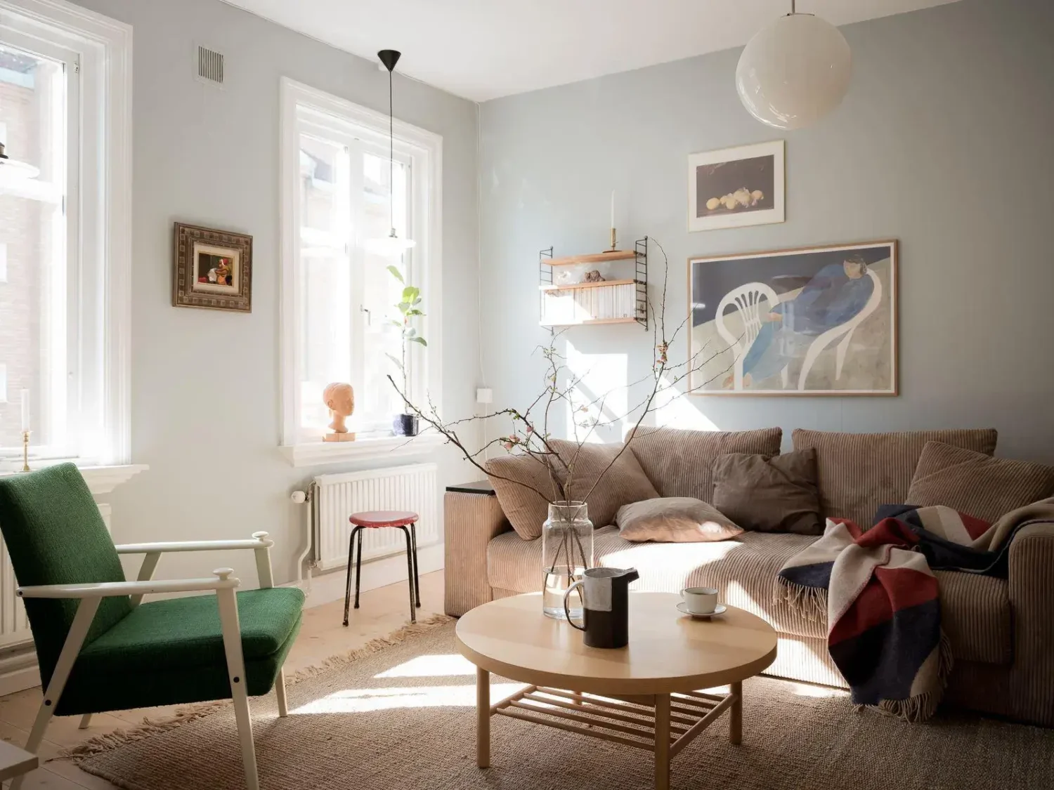 Gray Walls in a Renovated 19th-Century Gothenburg Apartment 3 living room green accent chair