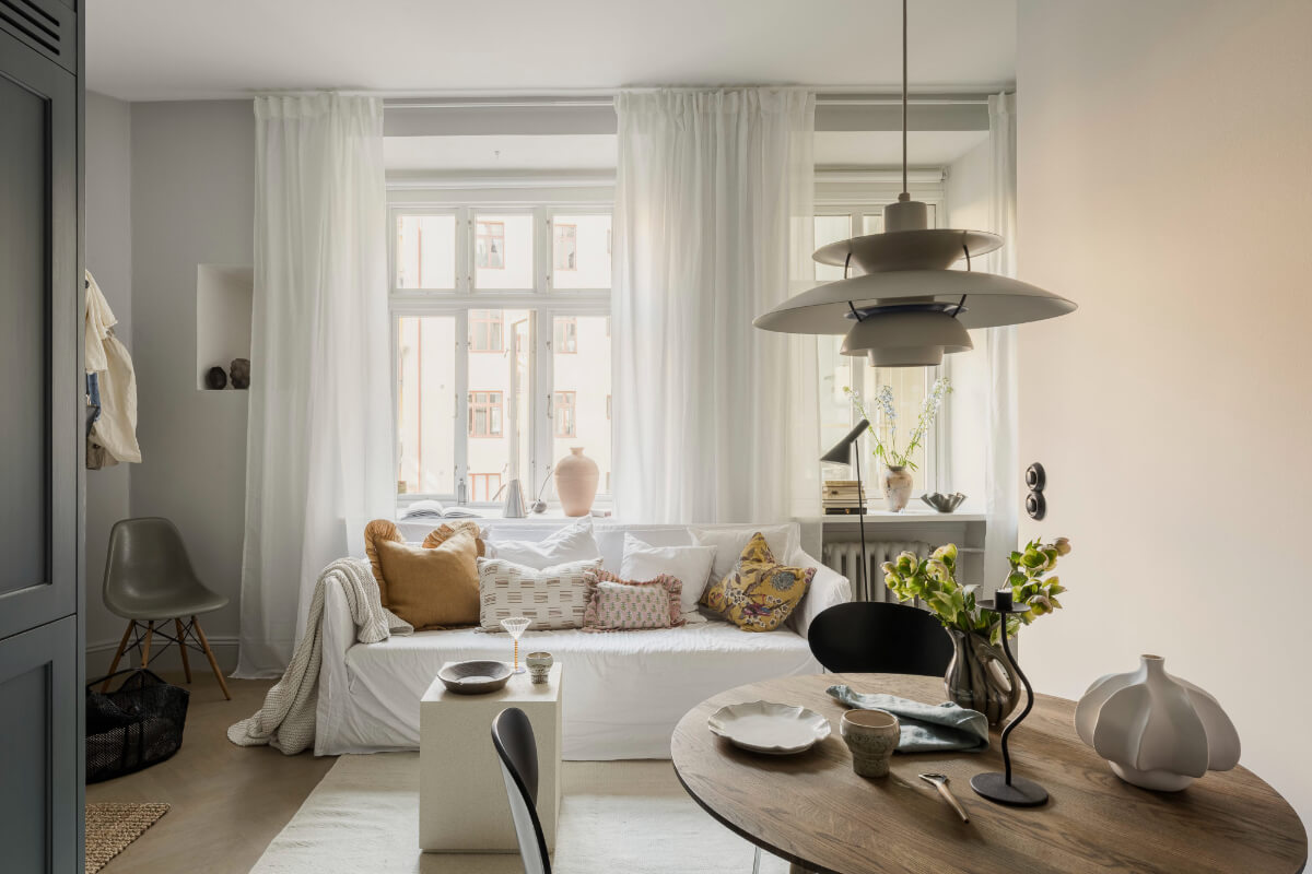 living room large windows round dining table