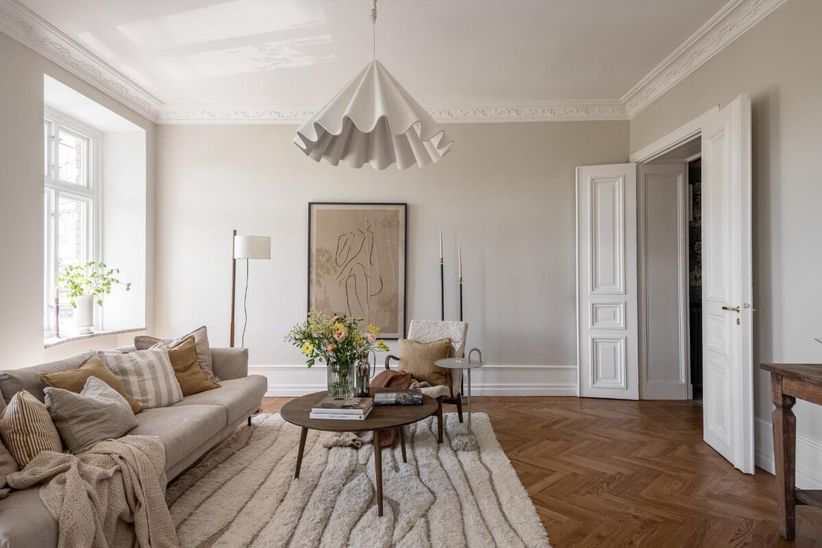 A Stunning Kitchen in a Classic Renovated Turn-of-the-Century Apartment 15 living room parquet floor light gray walls stucco