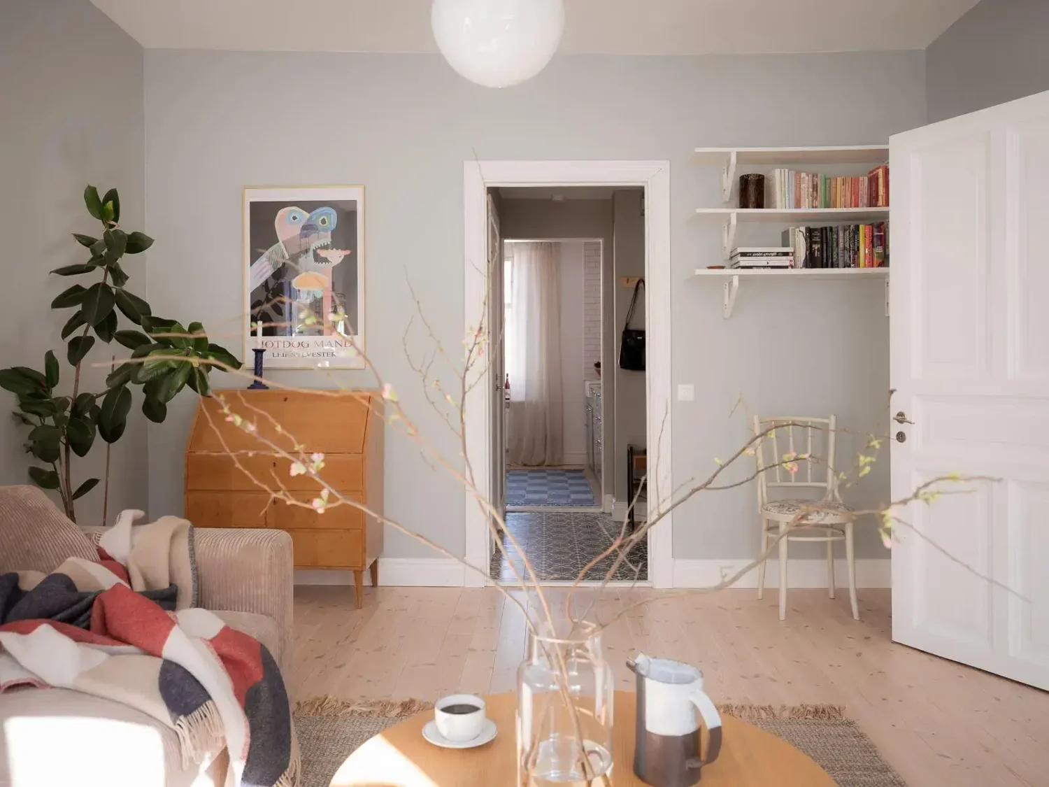 Gray Walls in a Renovated 19th-Century Gothenburg Apartment 5 living room shelves