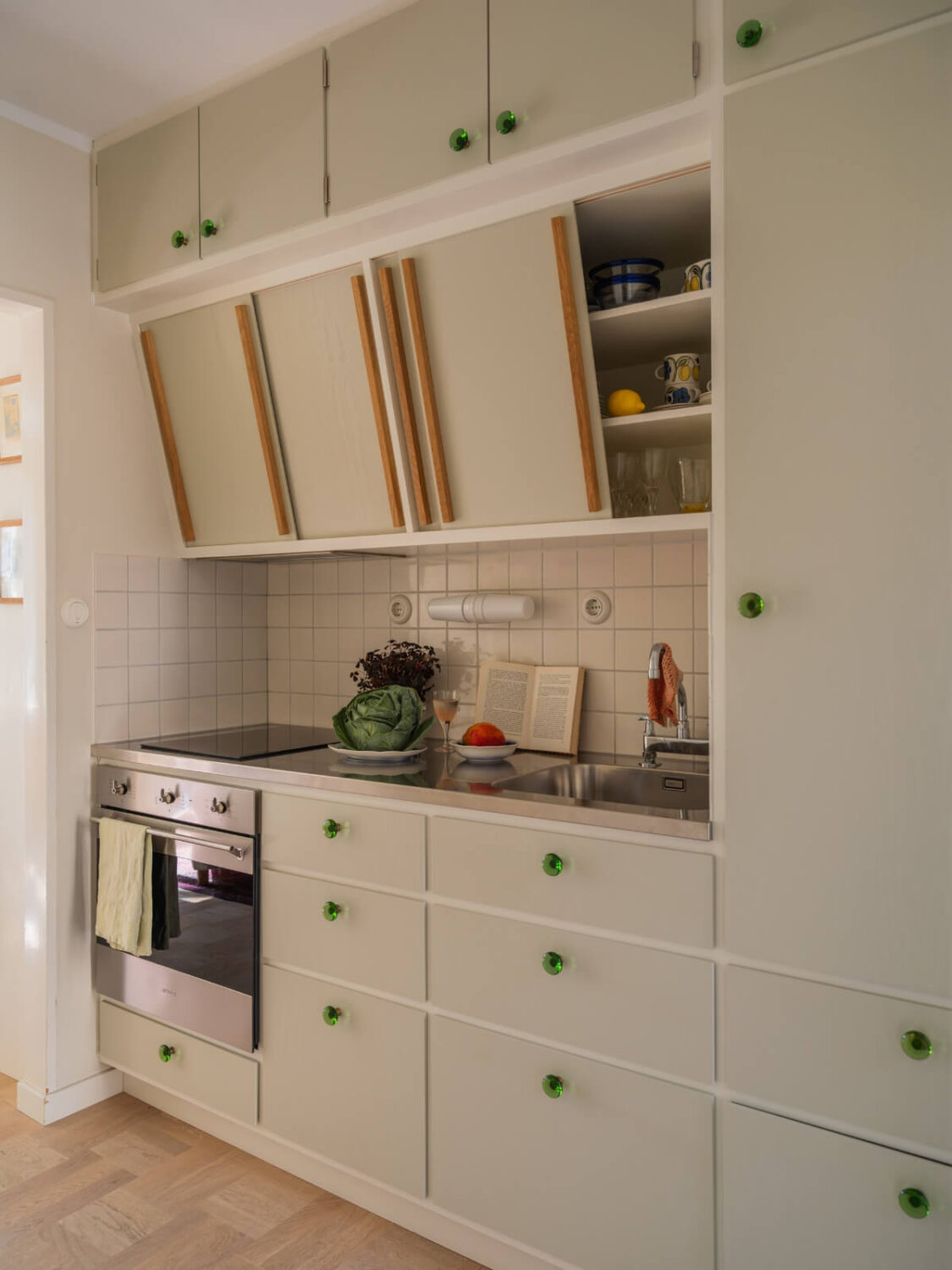 midcentury kitchen green knobs