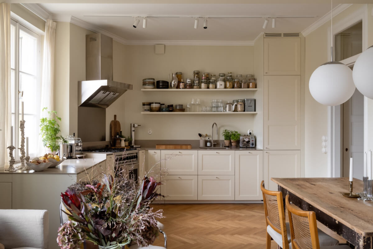 A Beige Color Palette and Built-in Bookshelves in a 1920s Apartment 6 open plan living space herringbone floor