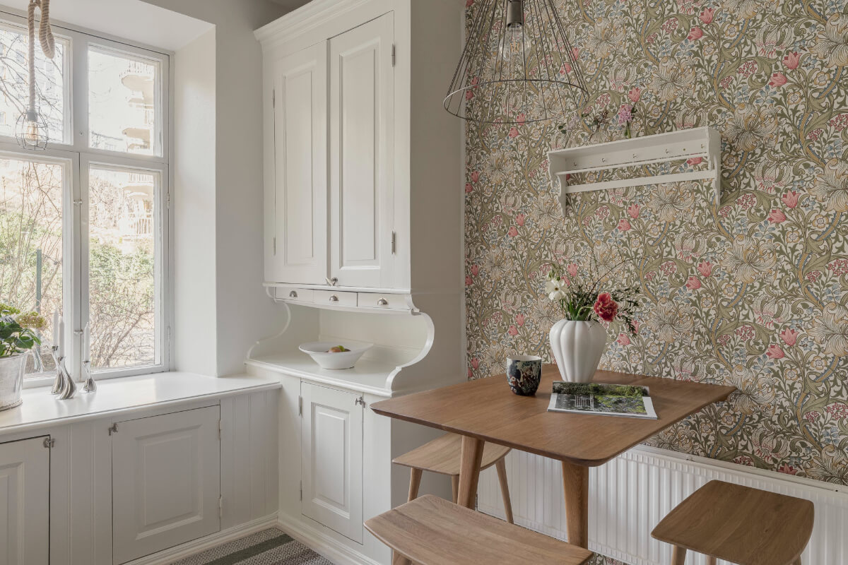 A Bright Swedish Apartment with Period Features and a Green Kitchen 8 original pantry cabinet bar table with stools