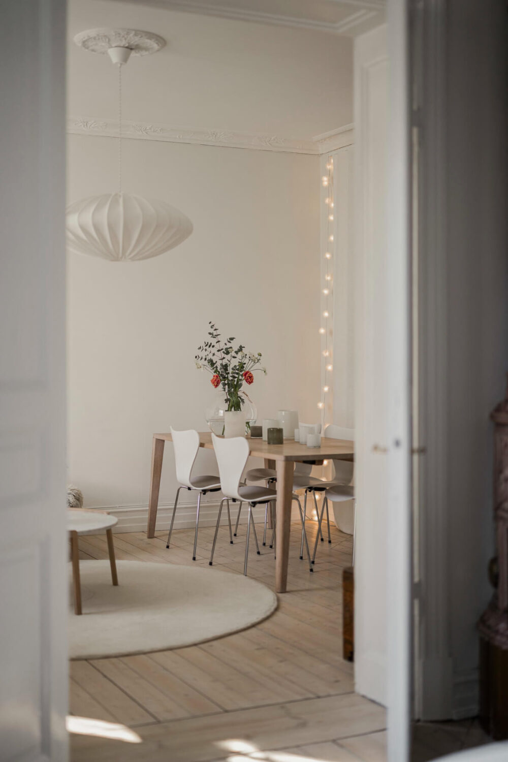 A Bright Swedish Apartment with Period Features and a Green Kitchen 15 peek into living room