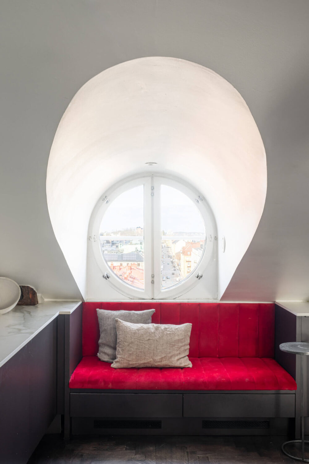 red velvet window seat attic apartment