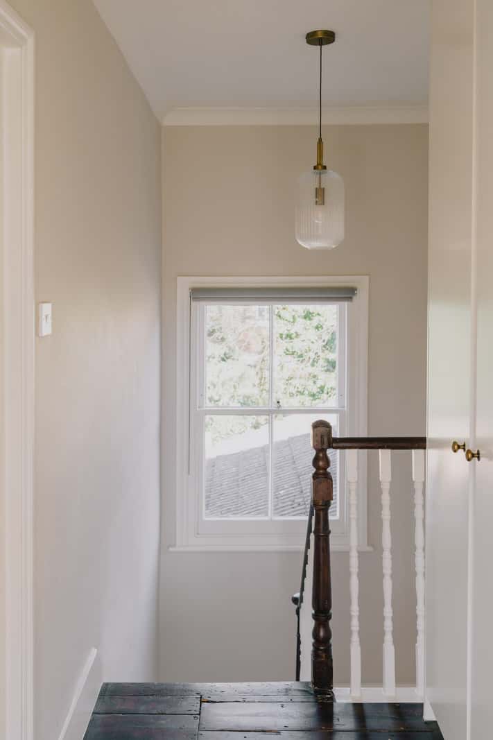 A Serene Color Palette and Built-In Shelves in a London Duplex 13 rustic floorboards first floor landing