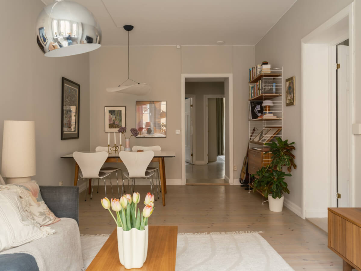 A Muted Palette and a Cozy Kitchen Breakfast Nook in a Swedish Apartment 6 scandi living room wooden floor