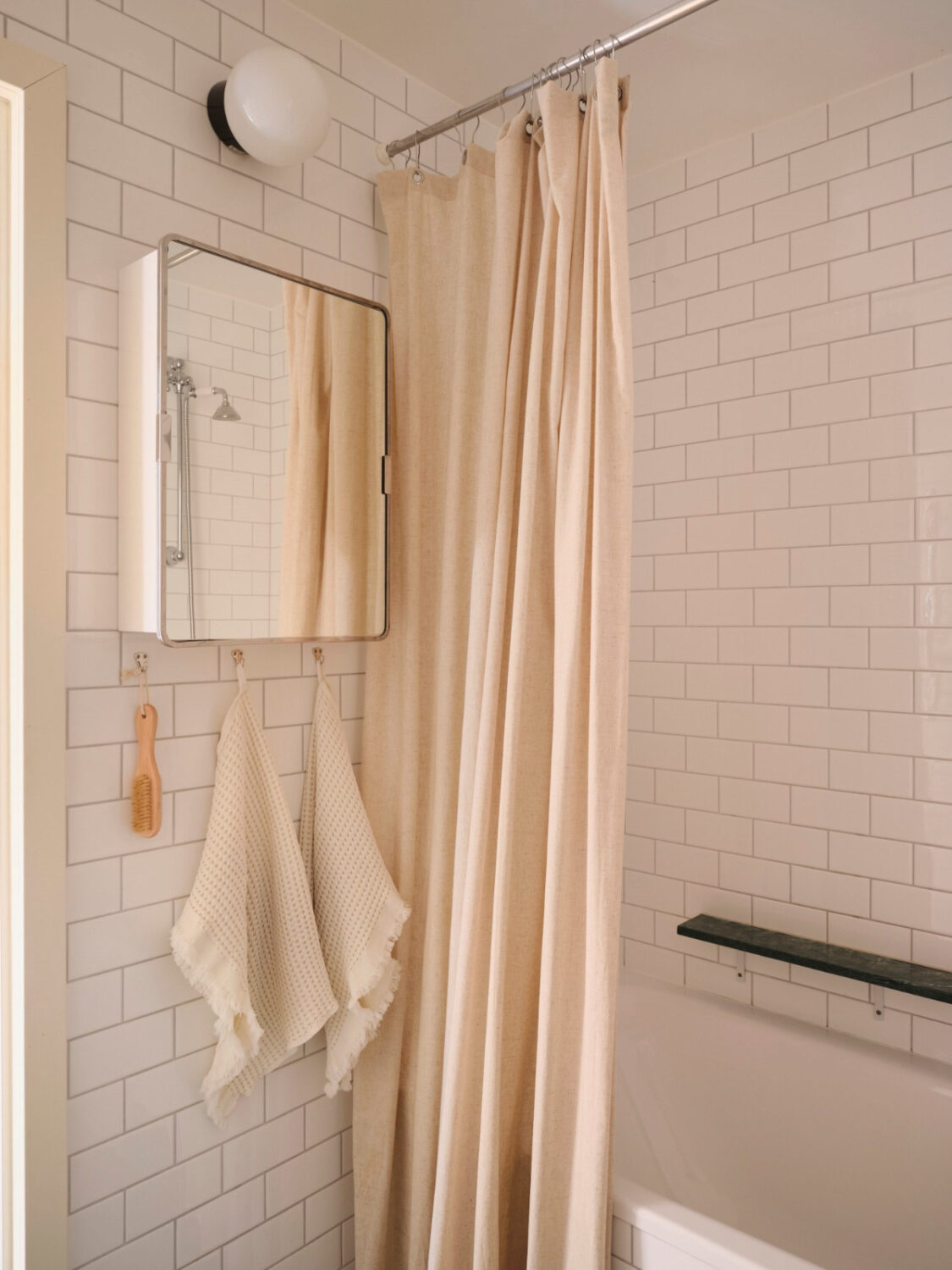 A Light-Filled Functionalist Apartment in Stockholm 17 small bathroom white tiles