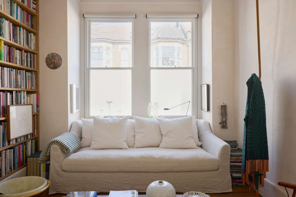 small living room floor-to-ceiling bookshelves