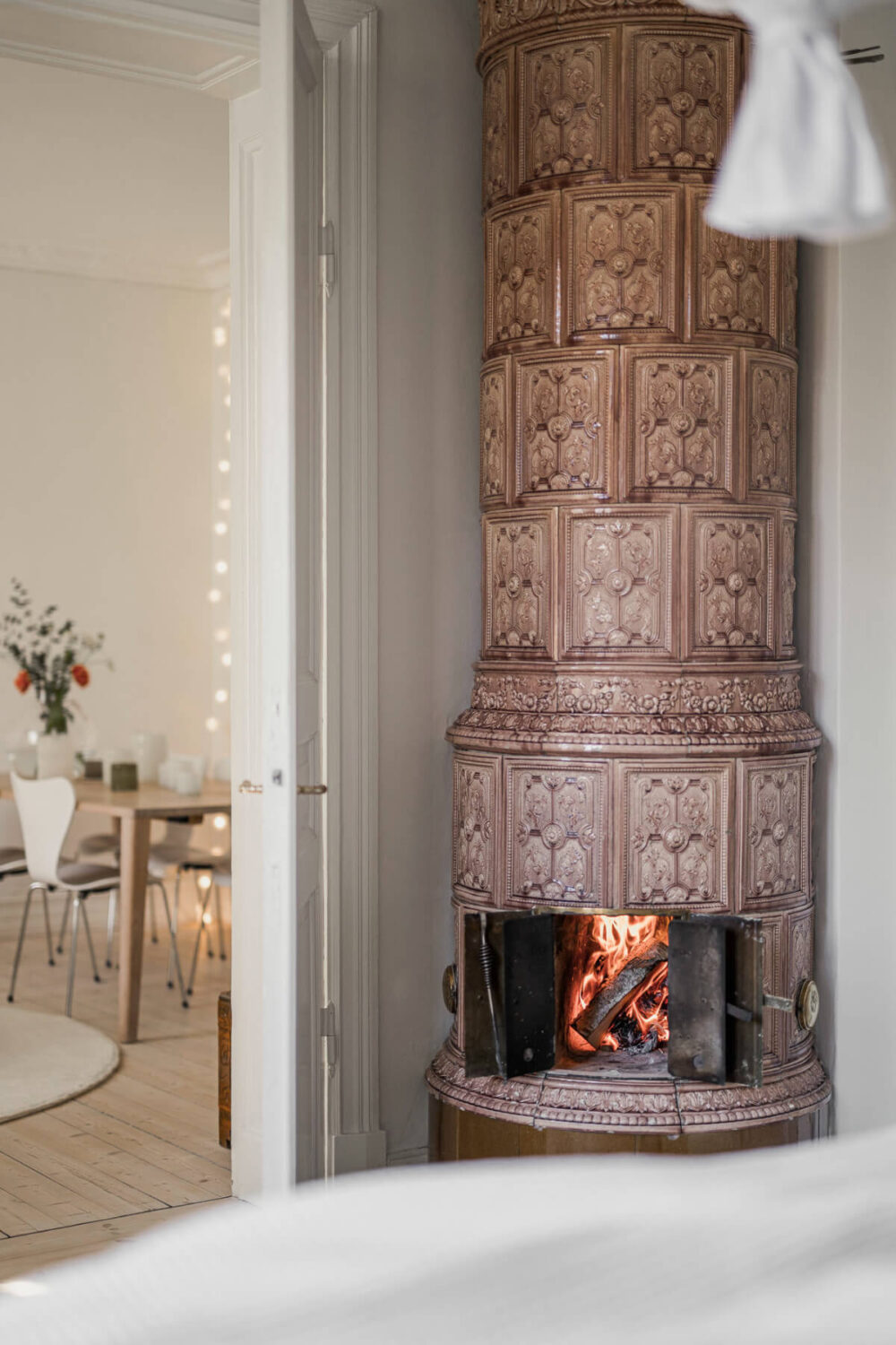 A Bright Swedish Apartment with Period Features and a Green Kitchen 22 swedish fireplace