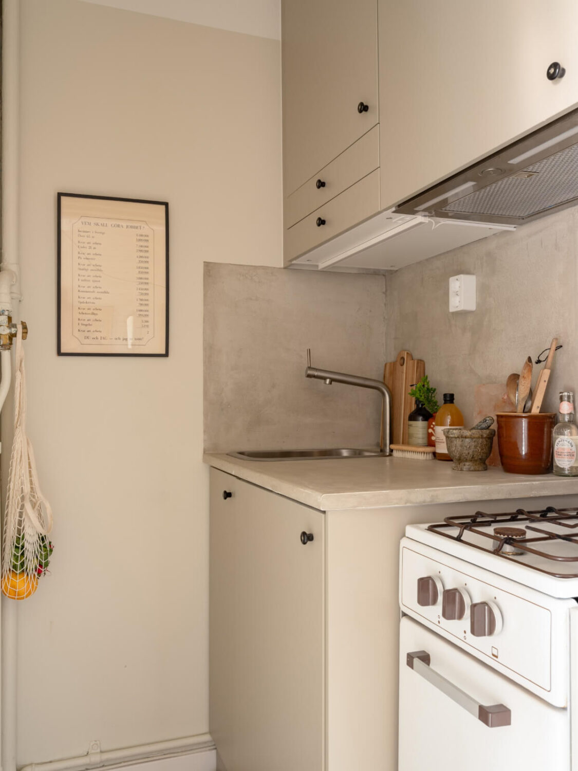 A Blue and Pink Studio Apartment with a Large Balcony 12 tiny gray kitchen