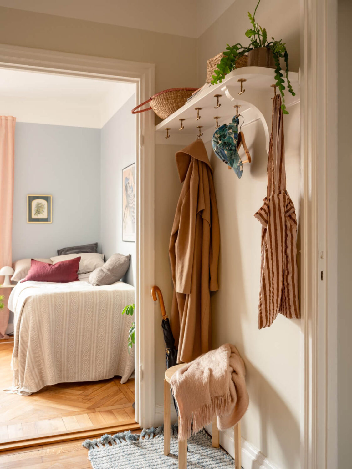 A Blue and Pink Studio Apartment with a Large Balcony 14 white hat shelf