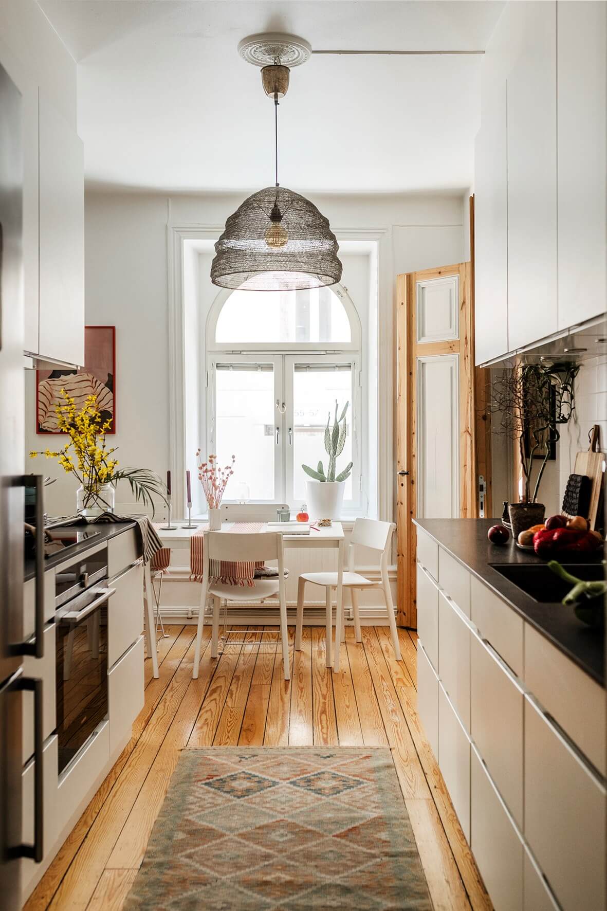 white kitchen large arched window