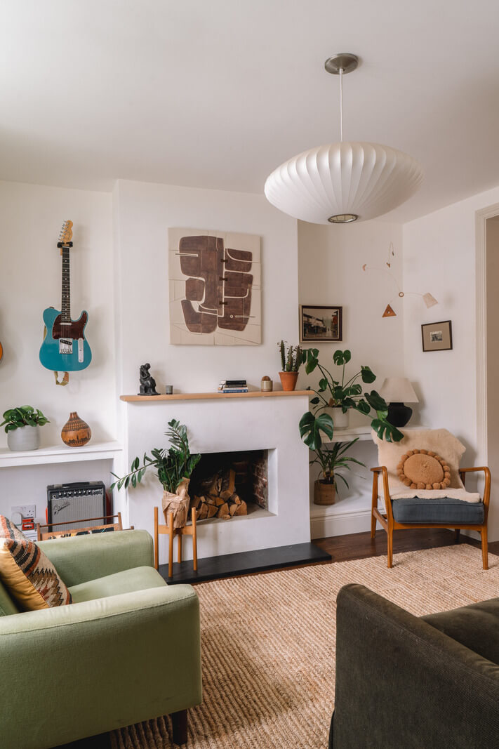 A Kitchen with Terracotta Tiles in a Renovated English Home 3 white living room green sofa fireplace