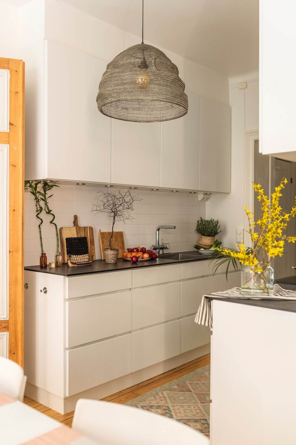 A Bright Family Apartment in Södermalm 9 white modern kitchen