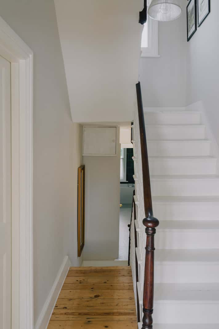 A Serene Color Palette and Built-In Shelves in a London Duplex 12 white-painted staircase