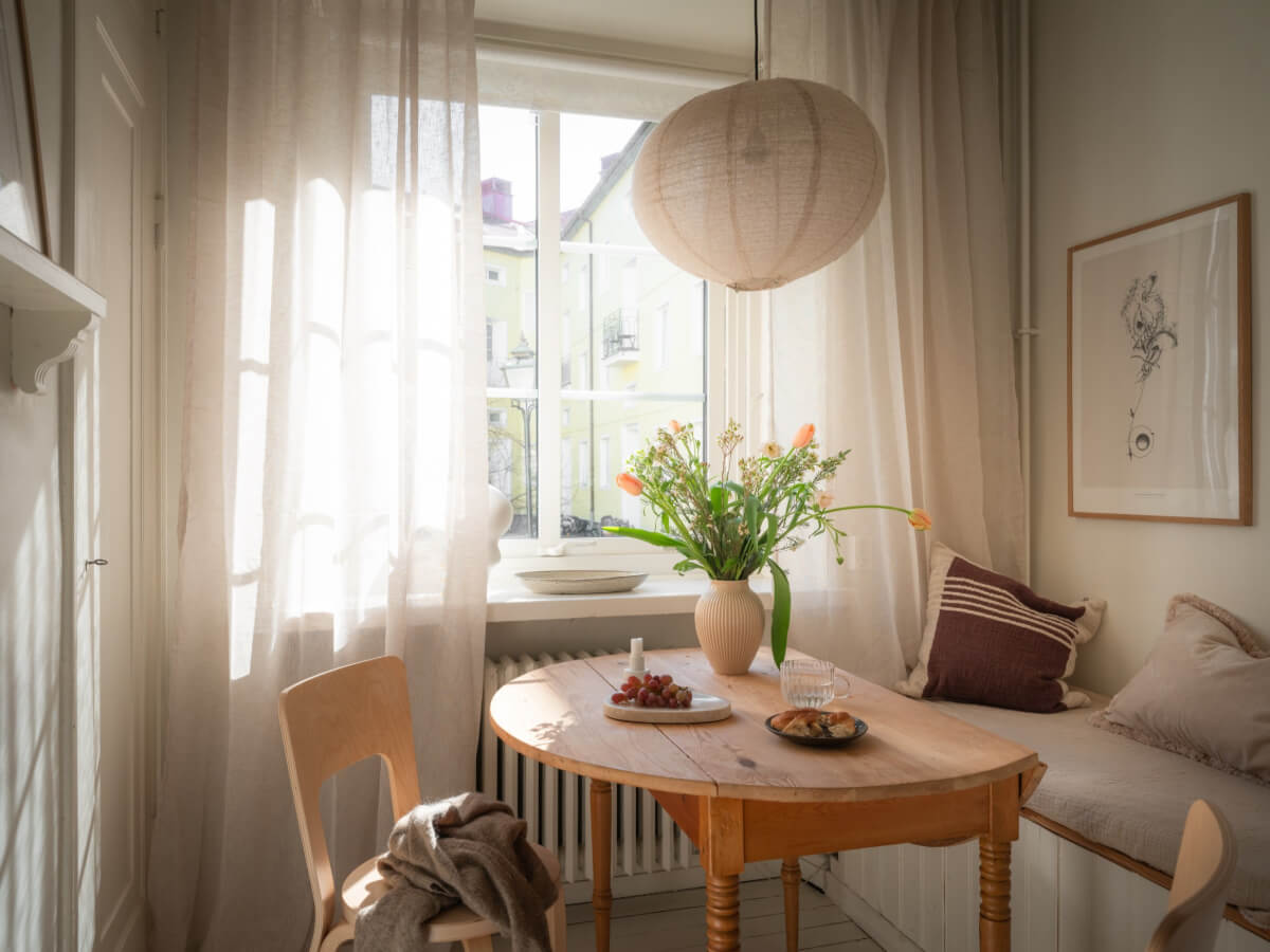 A Light-Colored Studio Apartment with a Cozy Kitchen 8 wooden folding kitchent table