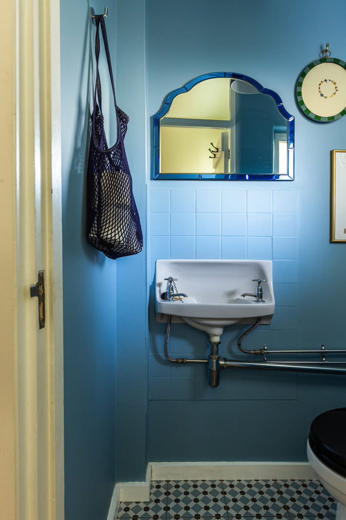 An Open-Plan Living Space and Colorful Bedrooms in a London Duplex 12 blue guest toilet patterned floor tiles