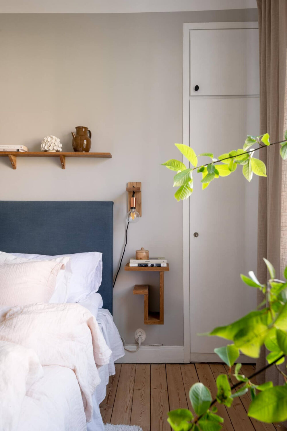 A Cozy Swedish Apartment with a Walk-In Pantry in the Sage Green Kitchen 21 blue headboard built-in wardrobes