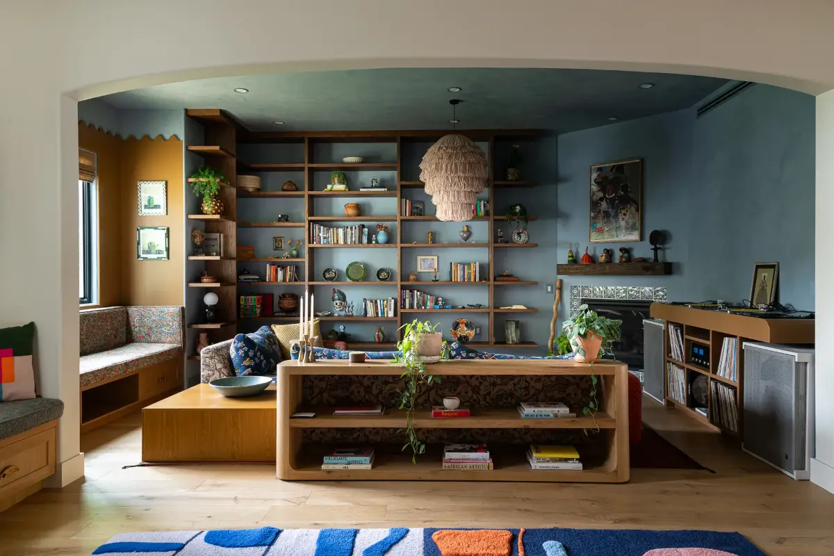 A Creative Sanctuary in Sherman Oaks Designed by Mendy Cheng 1 blue-living-room-ochre-yellow-window-seat-nook-custom-bookshelves