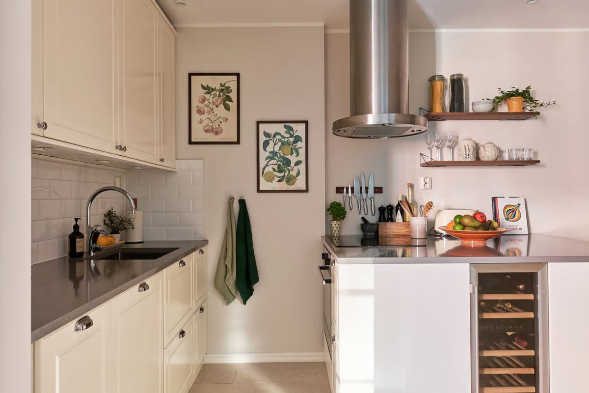 A Green Swedish Corner Apartment with an Open Floor Plan 17 classic white kitchen with island