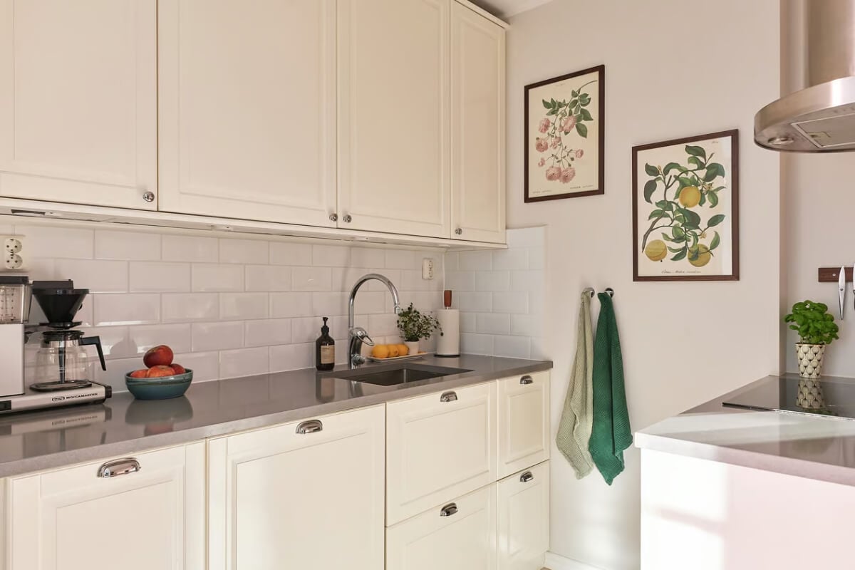 A Green Swedish Corner Apartment with an Open Floor Plan 18 classic white kitchen